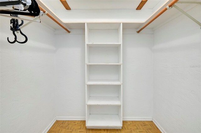 walk in closet featuring light parquet floors