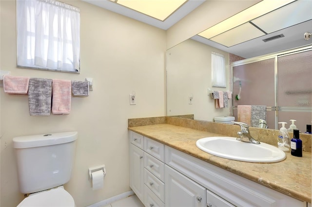 bathroom with toilet and large vanity