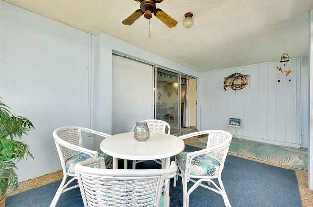 interior space with ceiling fan