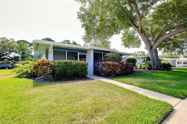 single story home featuring a front yard