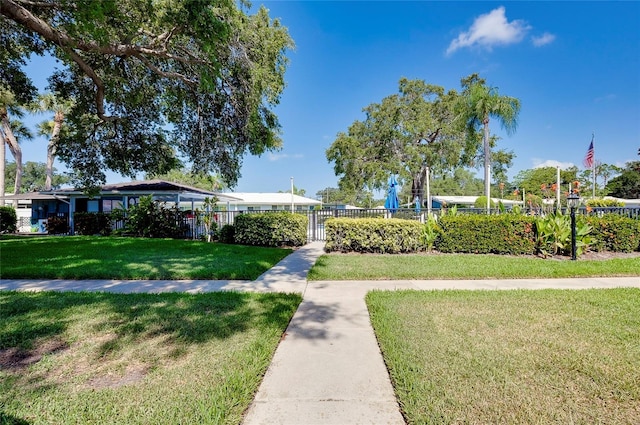 view of home's community featuring a lawn