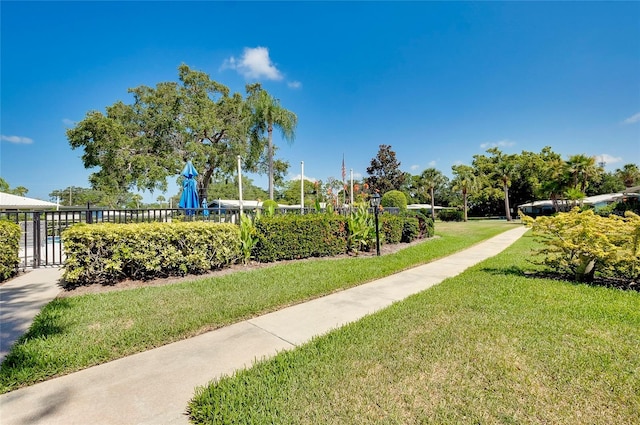 view of home's community featuring a lawn