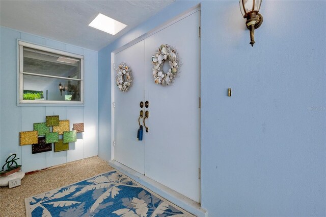 foyer with a textured ceiling