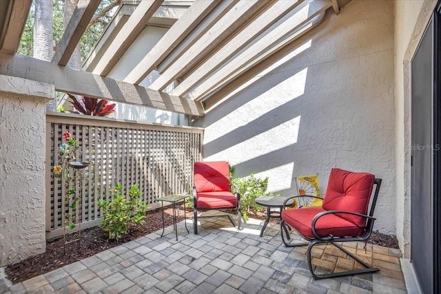 view of patio featuring a pergola