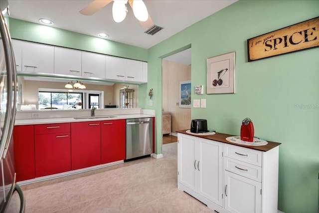 kitchen with stainless steel appliances, ceiling fan, sink, light tile patterned floors, and white cabinetry