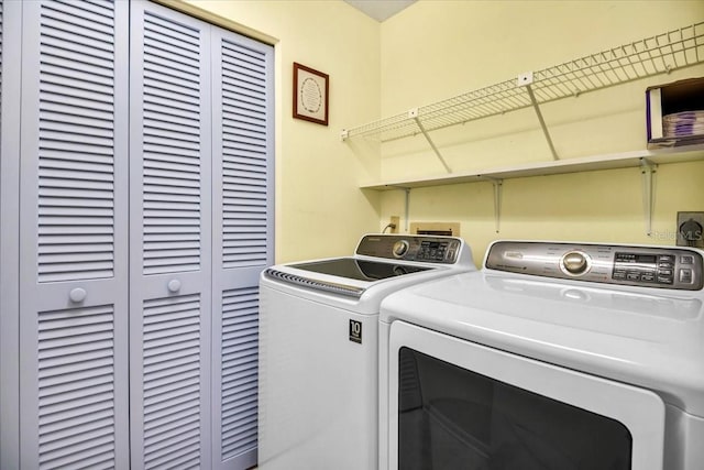 clothes washing area featuring washing machine and clothes dryer