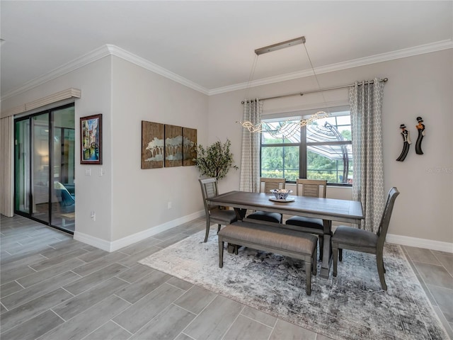 dining space featuring crown molding