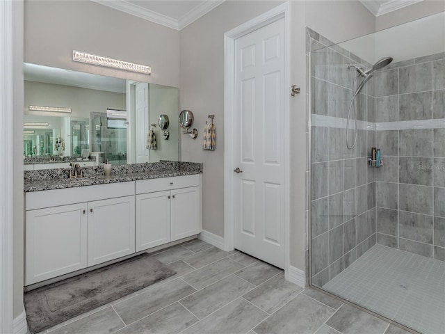 bathroom featuring walk in shower, vanity, and crown molding