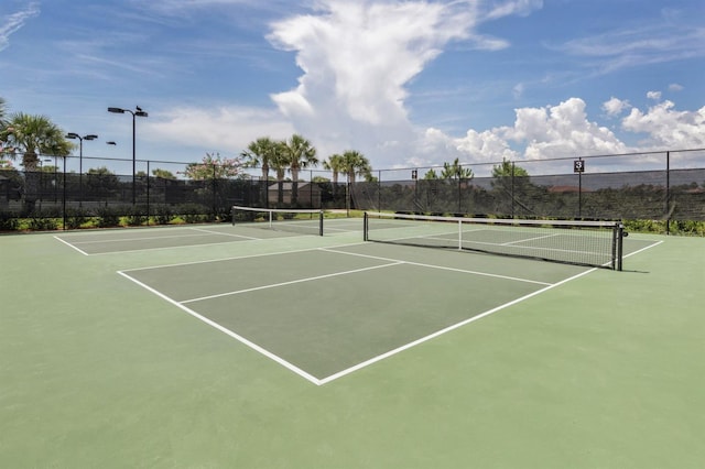 view of sport court with basketball hoop