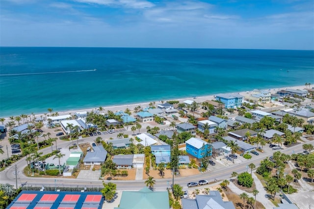 drone / aerial view featuring a view of the beach and a water view