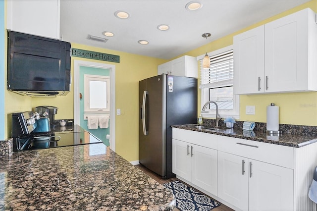 kitchen with stainless steel fridge with ice dispenser, sink, and white cabinets