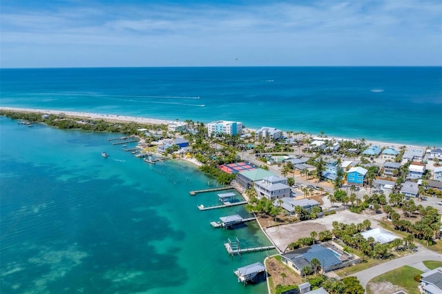 drone / aerial view with a water view and a view of the beach