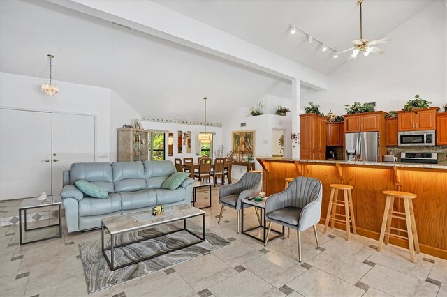 living room with beam ceiling, high vaulted ceiling, and a ceiling fan