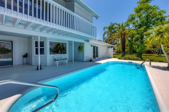 outdoor pool featuring a patio