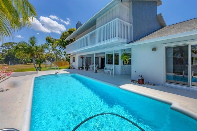 view of pool featuring a patio area and a fenced in pool