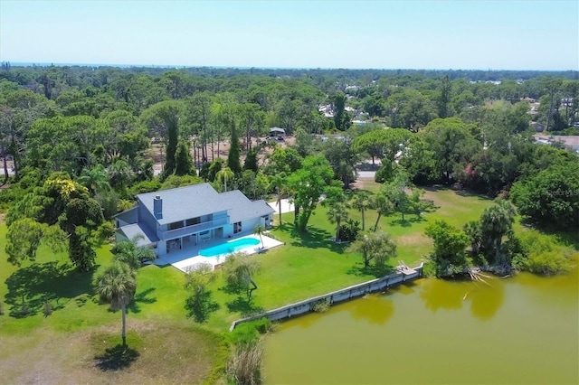 aerial view featuring a view of trees and a water view