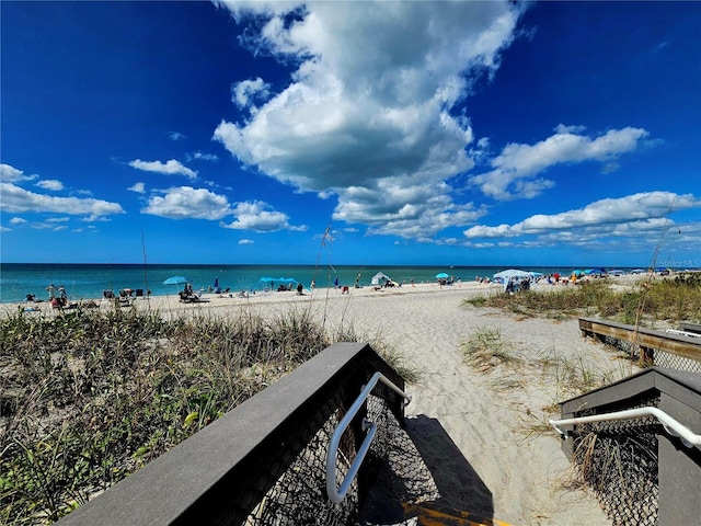 view of water feature with a beach view