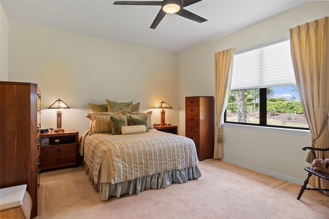 bedroom with light carpet and ceiling fan