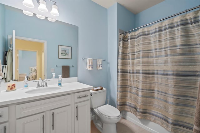 full bathroom with toilet, vanity, and shower / tub combo with curtain