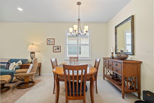 tiled dining space featuring a notable chandelier