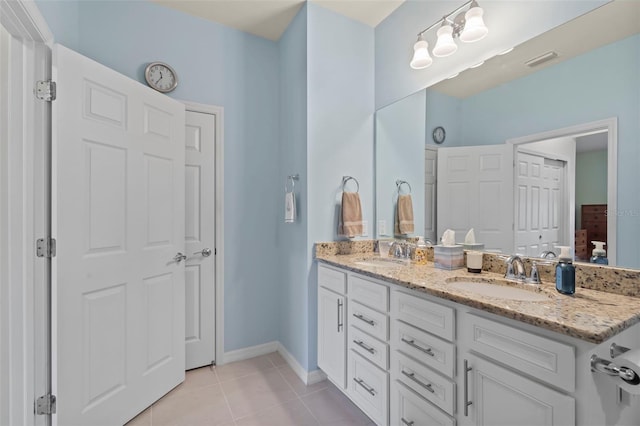 bathroom featuring tile patterned floors and vanity