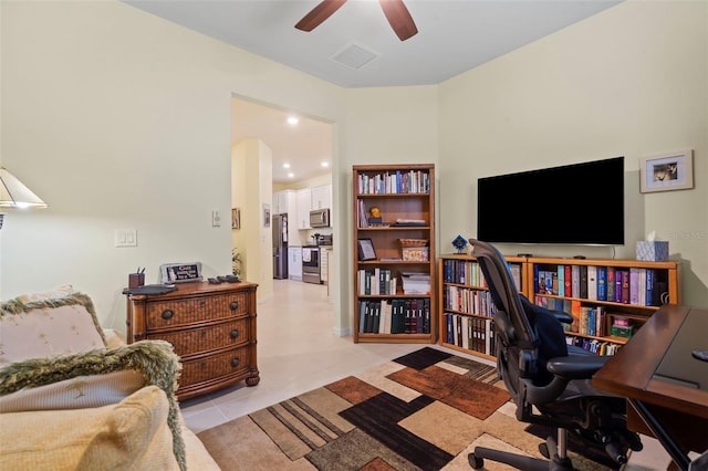 office area with ceiling fan and light tile patterned flooring