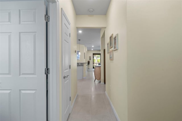 corridor with light tile patterned floors