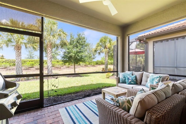 sunroom / solarium with ceiling fan