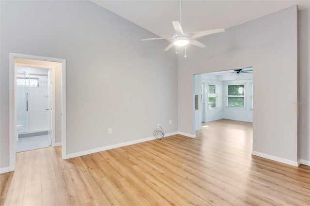 empty room with ceiling fan and light wood-type flooring