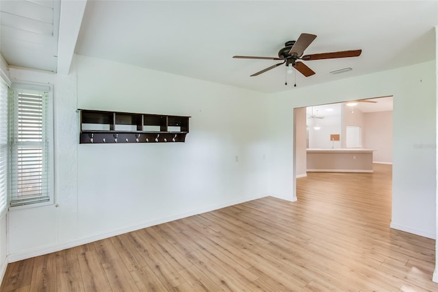 unfurnished room with ceiling fan and light hardwood / wood-style floors