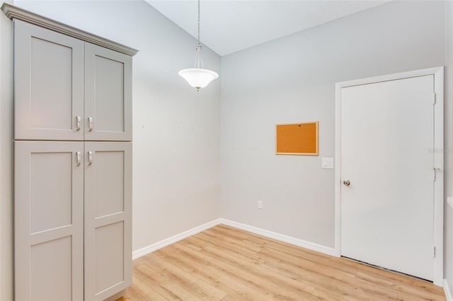 unfurnished dining area with light wood-type flooring