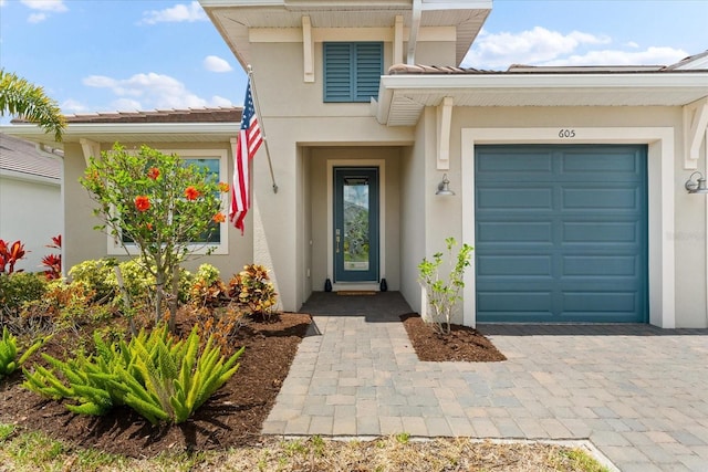 doorway to property with a garage