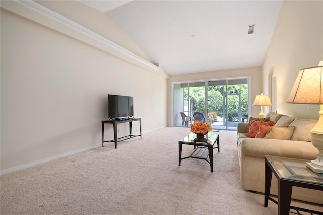 carpeted living room featuring lofted ceiling