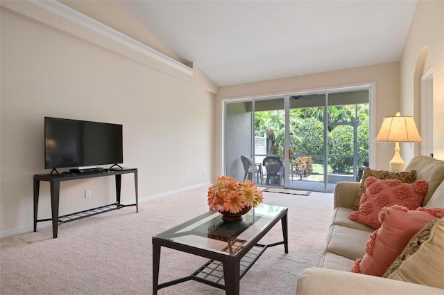 living room featuring light carpet and vaulted ceiling