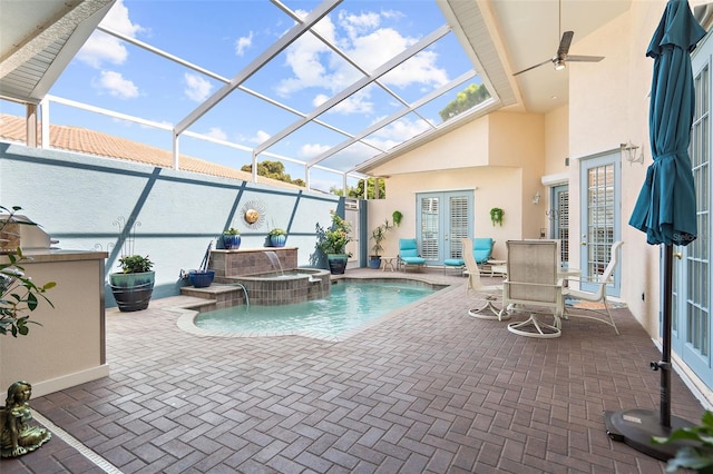 view of swimming pool with an in ground hot tub, a patio, ceiling fan, and a lanai