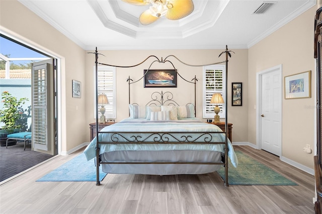 bedroom featuring access to exterior, ceiling fan, hardwood / wood-style floors, and crown molding