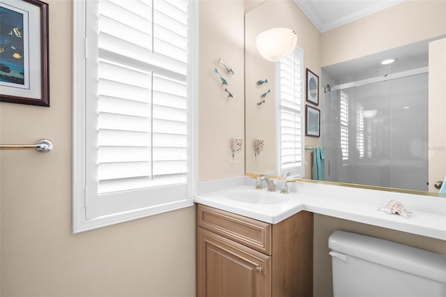 bathroom featuring vanity, toilet, and crown molding