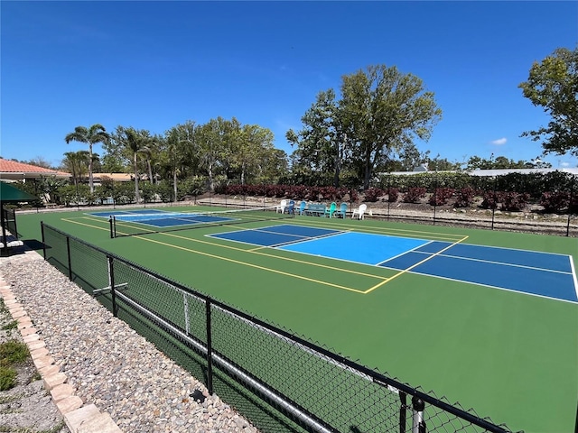 view of sport court with community basketball court and fence