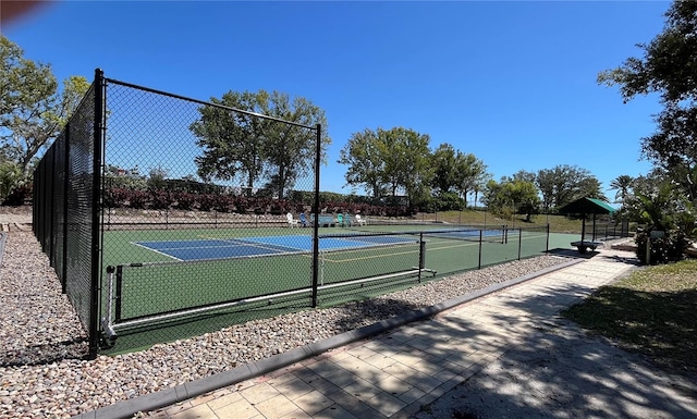 view of sport court with fence