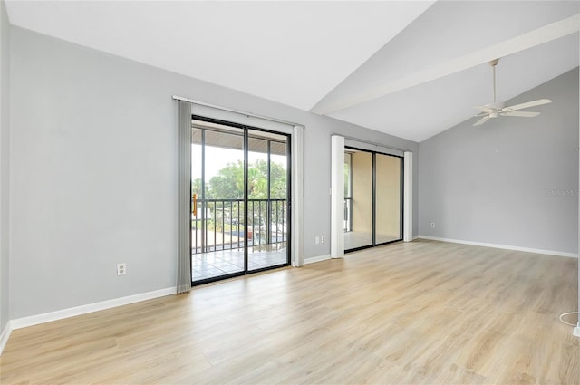 spare room featuring ceiling fan, vaulted ceiling, and light wood-type flooring