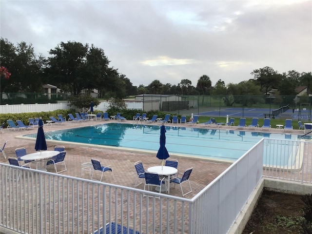 view of swimming pool with a patio area