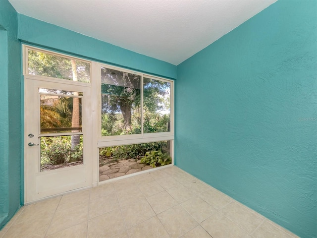 unfurnished sunroom featuring plenty of natural light