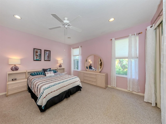 carpeted bedroom with ceiling fan