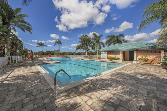 view of swimming pool featuring a patio area