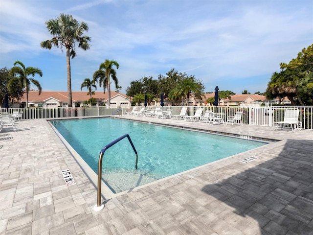 view of swimming pool featuring a patio area