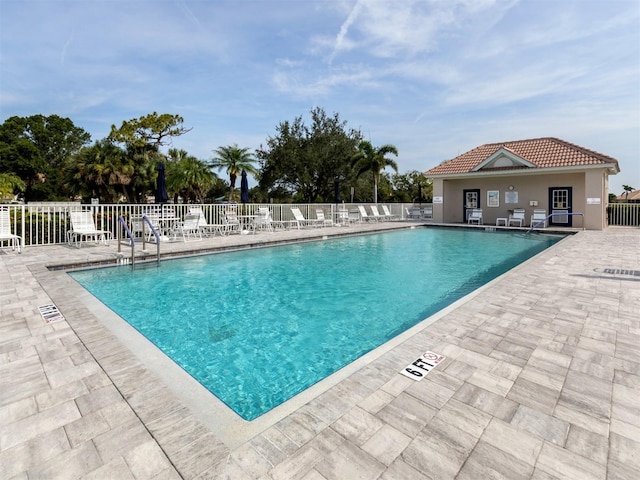 view of swimming pool featuring a patio