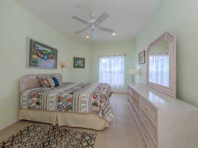 tiled bedroom featuring ceiling fan