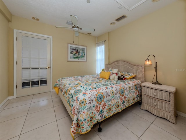 bedroom with ceiling fan and light tile patterned flooring