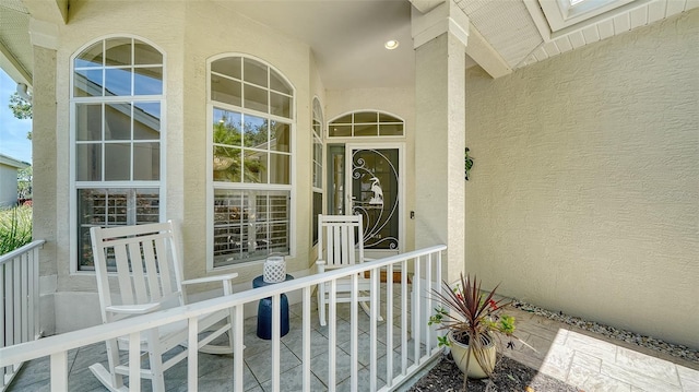 view of exterior entry with stucco siding