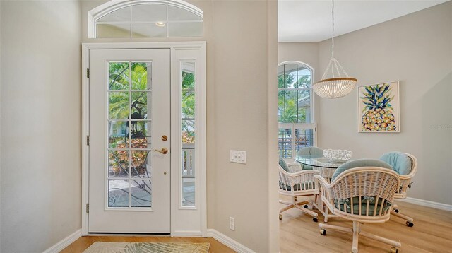 doorway with light hardwood / wood-style floors